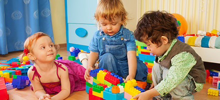 This stock image of children playing and smiling compels readers to click for more information.